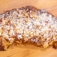 Almond Croissant · Almond-cream-filled croissant topped with toasted almond slices and powdered sugar

*contain...