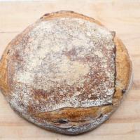 Kalamata Olive Sourdough Round (2Lb) · Light, colorful crumb, speckled with Kalamata olives and a floured golden crust. This bread ...