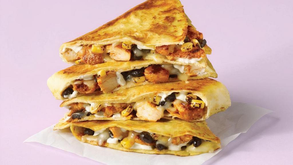 The Spicy Chicken Ranch Quesadilla · Spicy Grilled chicken, jalapeño ranch, black beans, roasted corn, pico de gallo & jack cheese in a jalapeño tortilla. That’s hot.