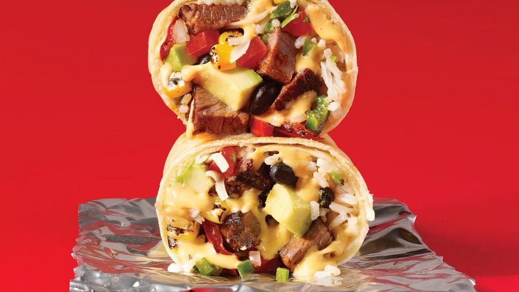 Spicy Steakhouse · Carne asada steak, chipotle queso, black beans, white rice, . jack cheese, sautéed peppers & onions, roasted corn & . avocado all wrapped in a house-made jalapeño tortilla. This . ain’t your daddy’s steakhouse.