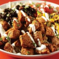 The Spicy Chicken Ranch Bowl · Grilled chicken, jalapeño ranch, black beans, white rice, roasted corn, pico de gallo & jack...