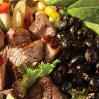 Spicy Steakhouse Salad · Carne asada steak, fresh mixed greens, black beans, jack cheese, pico de gallo, roasted corn...