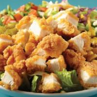 The Fried Chicken Picnic Salad · Fried chicken, mixed greens, ranch coleslaw, pico de gallo, green chilies, roasted corn & ja...