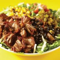 *New* Cravin' Carnitas Salad · Pork carnitas, mixed greens, black beans, roasted corn, pickled jalapeños, pico de gallo, ja...