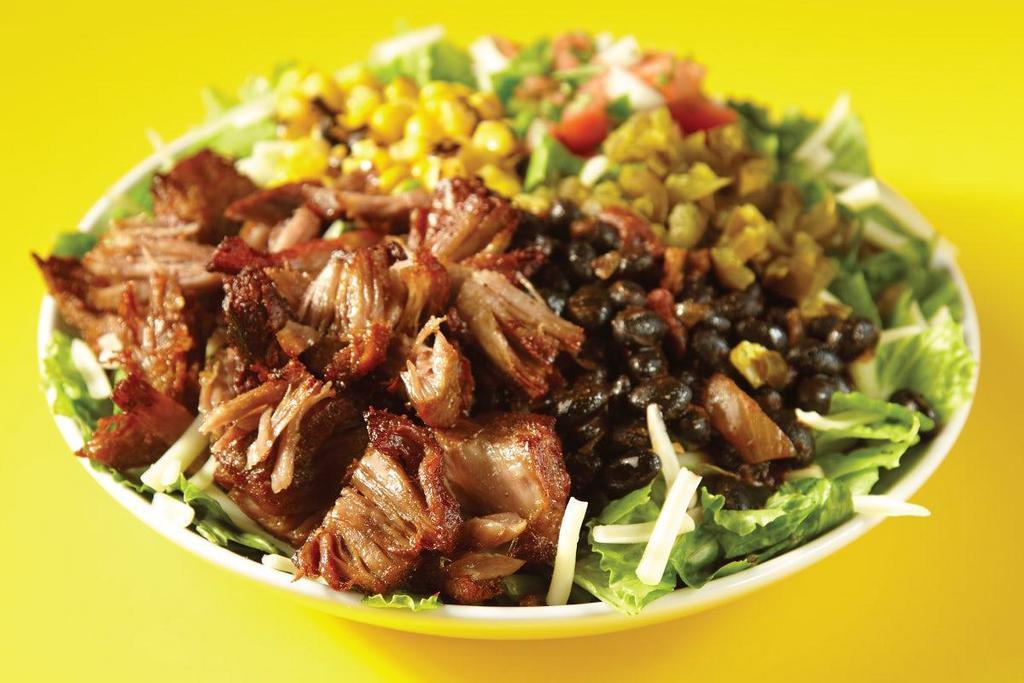 *New* Cravin' Carnitas Salad · Pork carnitas, mixed greens, black beans, roasted corn, pickled jalapeños, pico de gallo, jack cheese. Oink, oink, baby.. Recommended Creme Chipotle Dressing