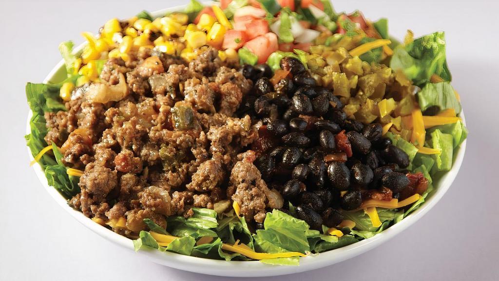 The Tex-Mex Flex Salad · Ground beef, mixed greens, black beans, roasted corn, pico de gallo, pickled jalapenos & cheddar cheese. There’s no humble here.. Recommended Buttermilk Ranch Dressing. A bit too spicy for you? Choose Tame it Down and we’ll remove the pickled jalapenos.