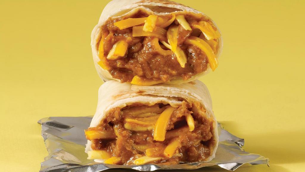 Kids Burrito · Flour tortilla, Beans, Cheddar Cheese with your choice of Chicken or Ground Beef.