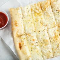 Cheesy Garlic Bread · Comes with (1) 4oz Marinara