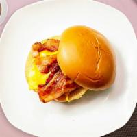 Giving You The Bacon Sandwich · Scrambled egg, bacon, and cheddar cheese served on bread.