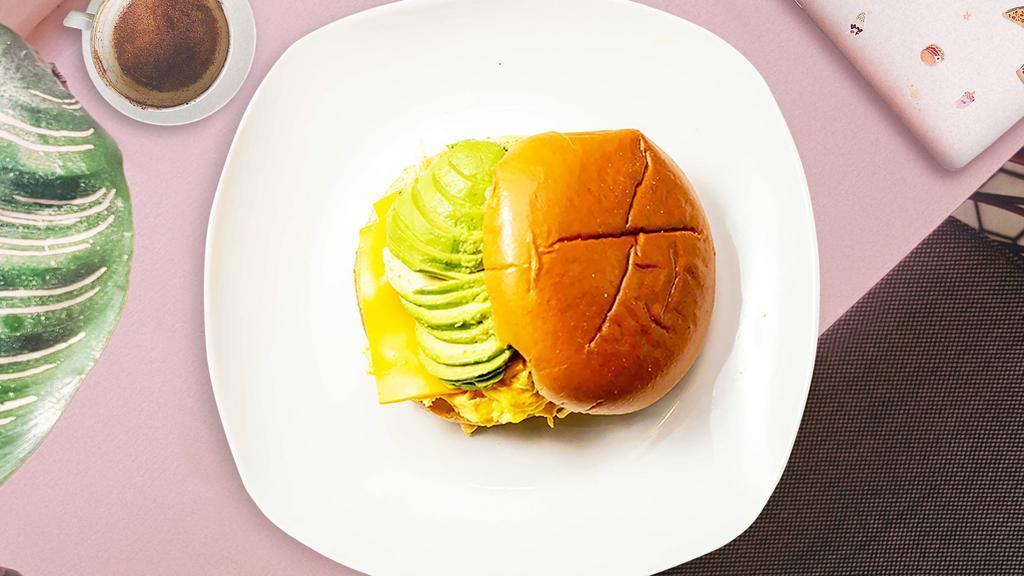 Visions Of Avocado Sandwich · Avocado, scrambled egg, and cheddar cheese served on bread.