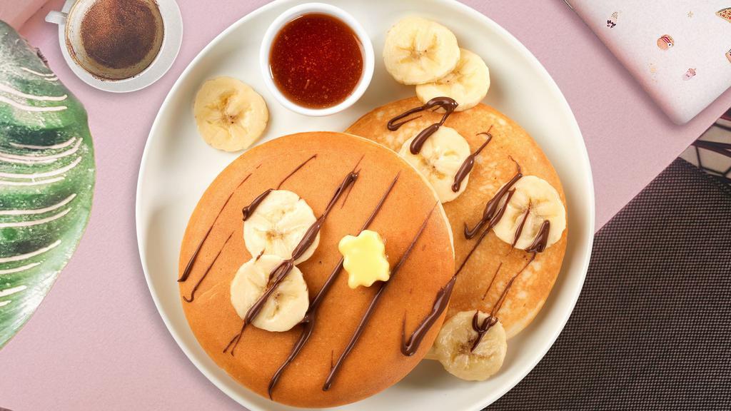 Minion'S Banana Nutella Pancake · Fluffy banana nutella pancakes cooked with care and love served with butter and maple syrup. Served in pairs.