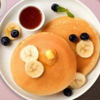 Berry Banana Pancakes · Fluffy banana and berries pancakes cooked with care and love served with butter and maple sy...
