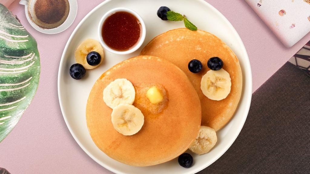 Berry Banana Pancakes · Fluffy banana and berries pancakes cooked with care and love served with butter and maple syrup. Served in pairs.