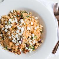 Mikonos Bowl · Orzo, baby spinach, artichokes, sun-dried tomatoes, capers, olives, crumbled feta, chickpeas...