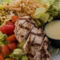 Mini Baja Salad With Grilled Chicken · Romaine, grilled chicken breast, roasted corn, queso fresco, guacamole, tortilla strips, cit...