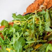 Pork Chop Milanese Delivery · pickled peppers, charred red onions, arugula