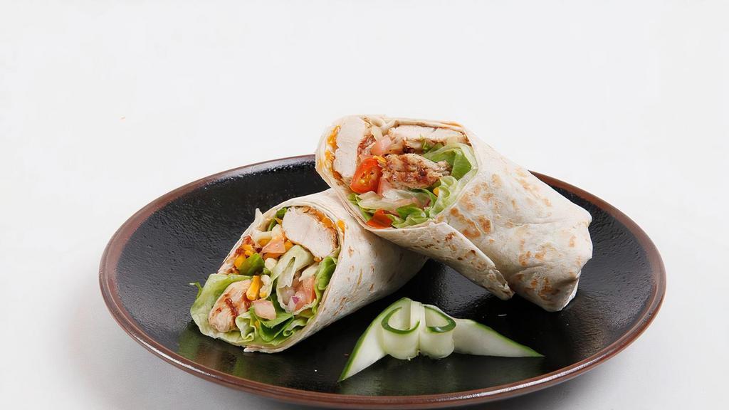 Grilled Chicken Wrap · Grilled Chicken, lettuce, tomatoes, red onions, cheddar cheese, spicy mayo dressing.