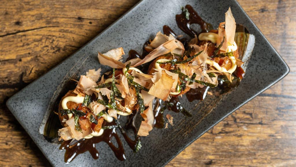Takoyaki (4) · Octopus fritters topped with kewpie mayo, okonomiyaki sauce, bonito flakes, shredded seaweed.