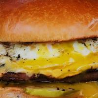 Individual Morning Burger · Grilled steak, eggs, american cheese and tomatoes in a brioche bread burger. Served with hom...