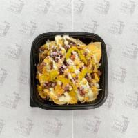 Beef Chili Nachos · corn nachos, fresh ground  beef chili with beans topped with diced Tomato ,red onion,  corn,...