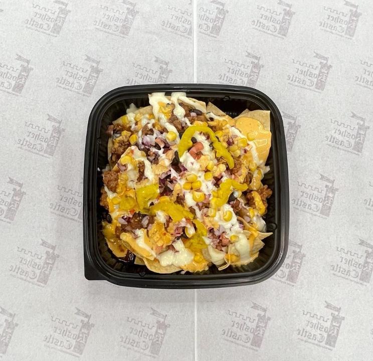 Beef Chili Nachos · corn nachos, fresh ground  beef chili with beans topped with diced Tomato ,red onion,  corn,
smothered with spicy aioli garlic aioli
pickled jalapenos
