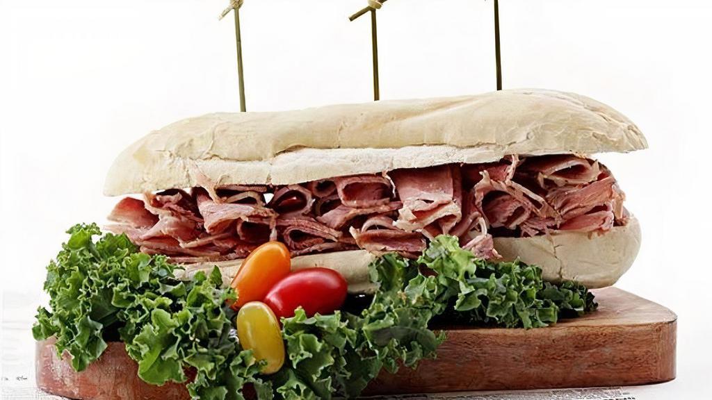 Corned Beef Sandwich · All Sandwiches served on baguette w pickles & cole slaw choice of wrap, W/W Wrap & W/W baguette