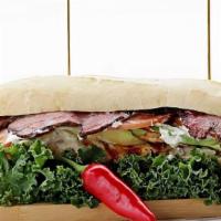 California Sandwich · Grilled chicken Breast; . Topped with pastrami, avocado, lettuce, tomato, with garlic aioli ...