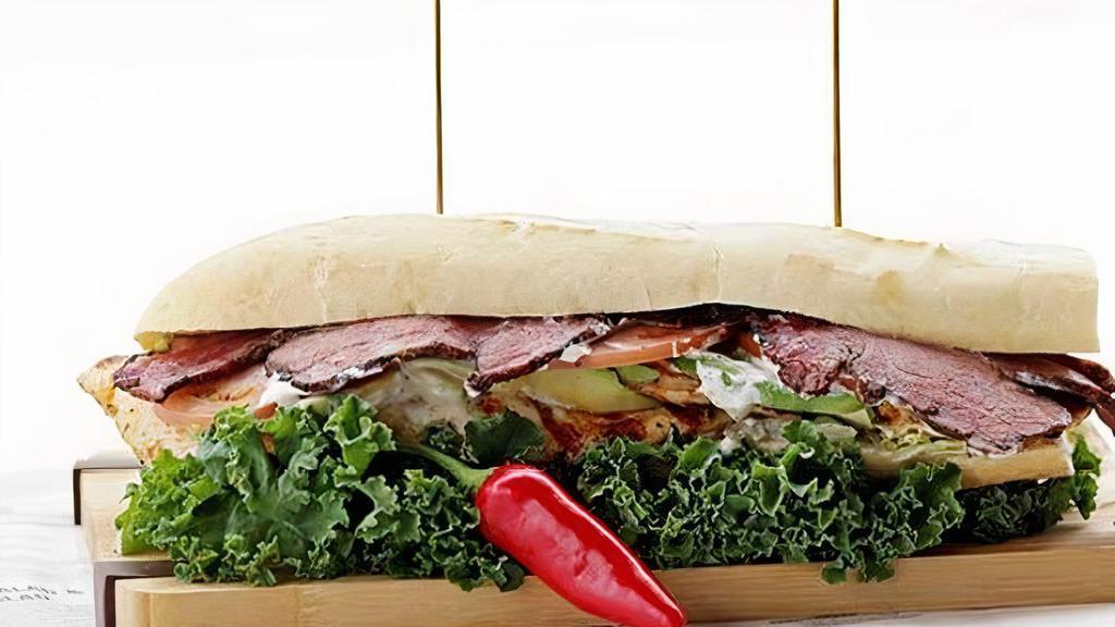 California Sandwich · Grilled chicken Breast; . Topped with pastrami, avocado, lettuce, tomato, with garlic aioli . Served on a Baguette