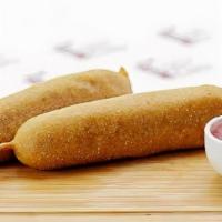 Corn Dog · CLASSIC BEEF HOT DOUG . BATTERD IN FAMOUSE . CORN BATTER . FRIED TO PERFECTION. SERVED ON ST...