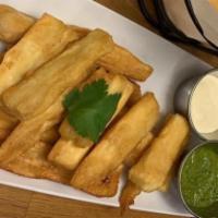 Yuca Frita Con Guasacaca (Gf)(V) · Crispy fried cassava with cilantro based green sauce *Nata upon request.