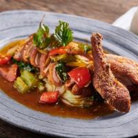 Duck Tamarind · Crispy roasted 1/2 duck in an aromatic tamarind sauce garnished with fried shallots and cila...