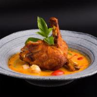 Duck Curry · Spicy. Crispy roasted 1/2 duck, pineapple, lychee, tomatoes, and bell peppers in coconut red...