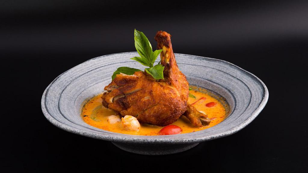 Duck Curry · Spicy. Crispy roasted 1/2 duck, pineapple, lychee, tomatoes, and bell peppers in coconut red curry.