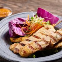 Chicken Satay · Grilled marinated chicken with our special peanut sauce and cucumber vinaigrette.