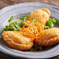 Kra-Pow Puff · Lightly deep-fried pastry puffs filled with minced chicken, string beans, cheese, and basil,...
