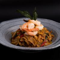 Pad Kee-Mao · Vegan option available. Spicy. Broad flat rice noodles stir-fried with spicy chili sauce, on...