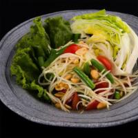 Papaya Salad · Spicy, gluten-free. Shredded green papaya in a disco dance party tossed with tomatoes, carro...