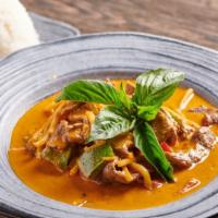 Red Curry · Stop! Get this! Bell peppers, bamboo shoots and basil leaves simmered in coconut milk with r...
