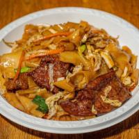 Beef Chow Fun · Flat noodles.