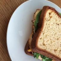 Turkey Cheddar Sandwich · Turkey, cheddar cheese, arugula and mustard on sliced bread