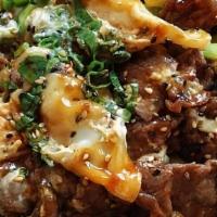 Spicy Steak Poke Bowl · Top Sirloin Steak smothered in a Spicy Sauce mixed with tobikko, toasted sesame seeds, and g...