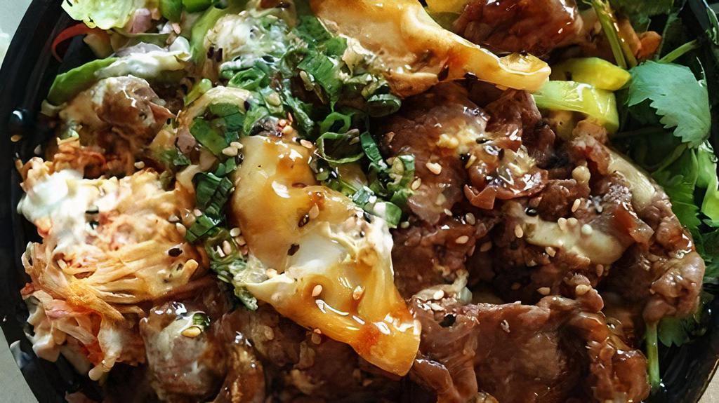 Spicy Steak Poke Bowl · Top Sirloin Steak smothered in a Spicy Sauce mixed with tobikko, toasted sesame seeds, and green onions