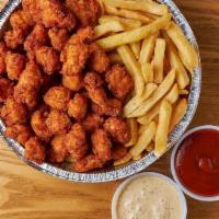 #32 Fried Chicken Bites Over Fries · Choose any 2 Sauces