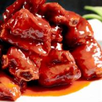 Sweet & Sour Pork Ribs · Boiled and braised pork rib mixed with sweet and sour sauce