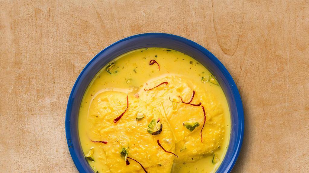 Supreme Rasmalai · Cottage cheese balls soaked in creamy water enrich with saffron.