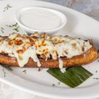 Maduro Montado · Sautéed ground beef and cheese in a baked sweet plantain.