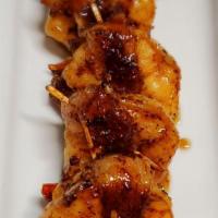 Alma Shrimp · Grilled Shrimp Wrapped in Bacon and Drizzled with Honey.