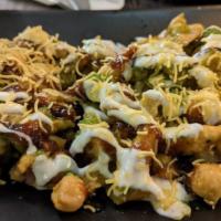 Papdi Chaat · Wheat crisps, chickpeas, potatoes, topped off with tamarind and cilantro mint chutney, sweet...