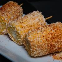 Elote · Grilled corn on the cob, chipotle mayo, cotija Cheese.
