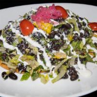 Black Beans Salad · 2 corn tortillas, romaine lettuce, black beans, cotija cheese, marinated onions, cherry toma...